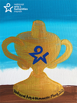 A paint of a gold trophy sitting on a brown platform against a blue sky. The trphy features the National Arts and Humanities Month logo and text.